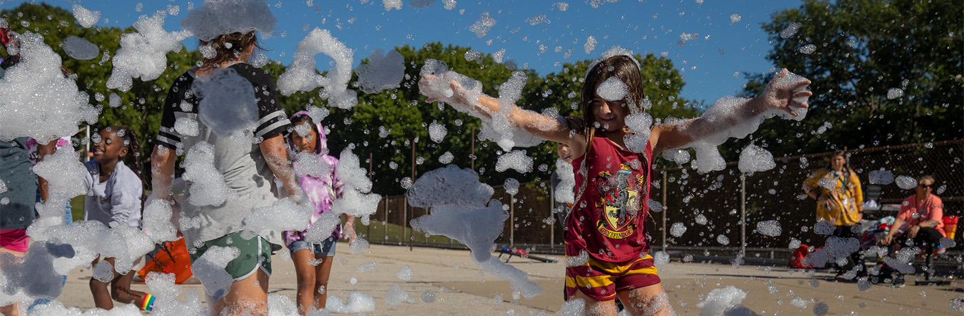 students playing with bubbles